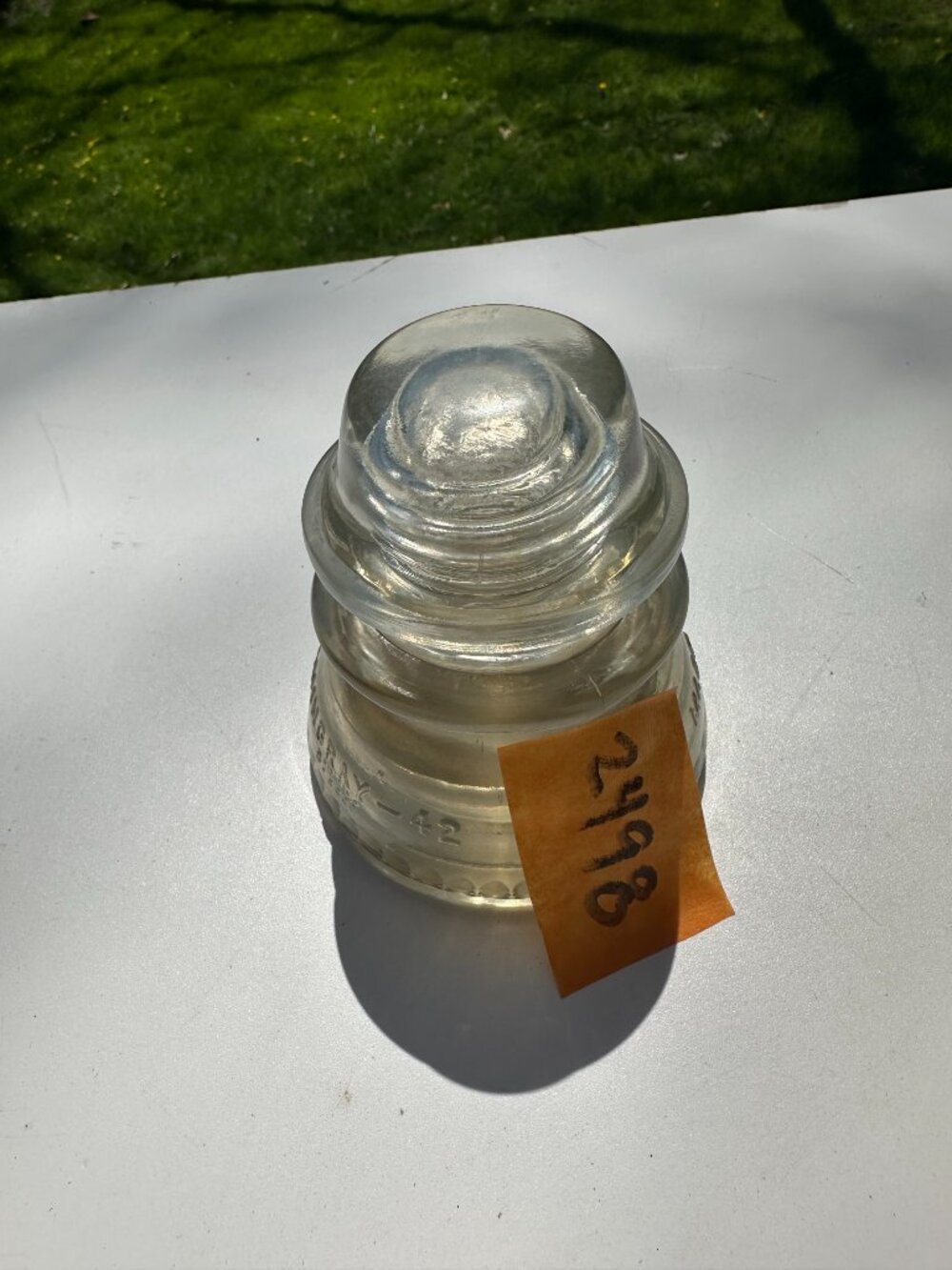 #2498 CLEAR GLASS INSULATOR EMINGRAY-42 USA 4"H X 3 5/8"W